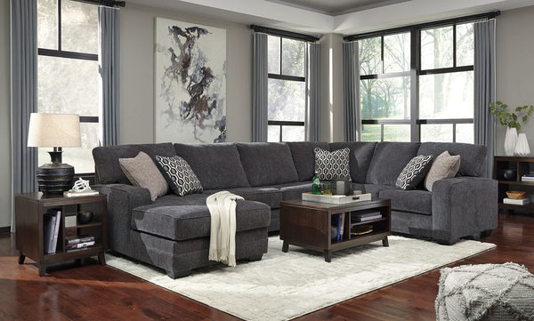  the sectionalâ€™s slate gray upholstery is