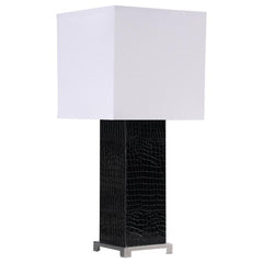 Imagine a crisp modern aesthetic working as a light source in your updated living room or bedroom. Designed with clean geometric principles, this contemporary lamp delivers a sharp, energetic attitude and a strikingly contrasting palette. An embossed croc