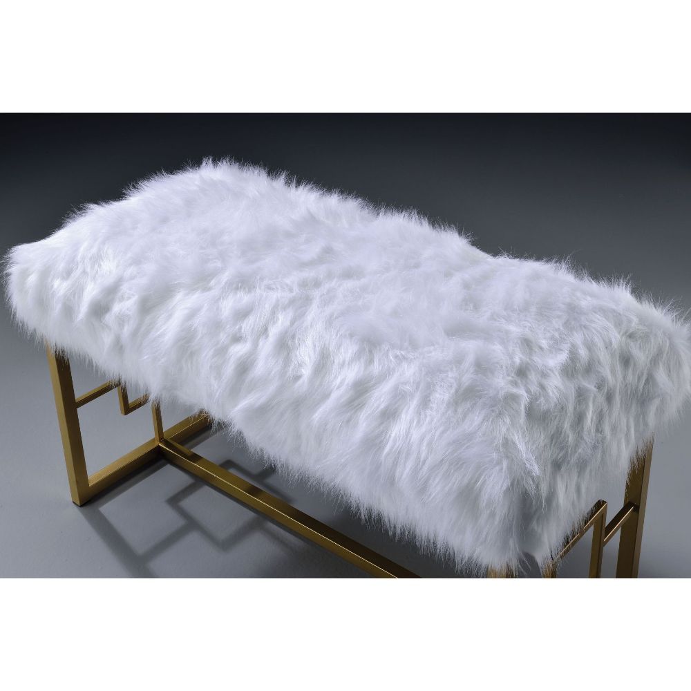 Exude an air of sophistication and comfort with this Bagley II bench. Featuring white faux fur seat cushion and gold metal base, this armless lounge bench is destined to be your favorite piece. Regardless where you placed it, it will always be the attenti
