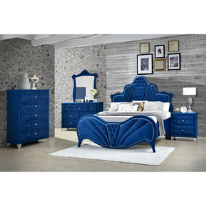 This fully padded blue velvet bedroom set is visually stunning, including beautiful channel tufting and contrasting welted trim arched head and footboards. Upholstered casegoods maintain the ambiance of this chic bedroom. Incorporating padded fronts, tape