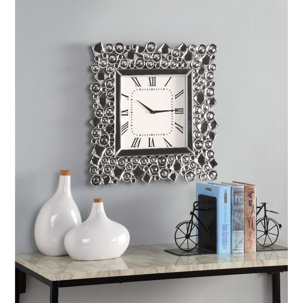 An even mix of function and fashion, this eye-catching Kachina wall clock keeps your eye on the hour with chic style. The faux gem inlay adorned frame with mirrored panels add a dash of glamour. Lean into this piece-'s traditional influence by adding it t