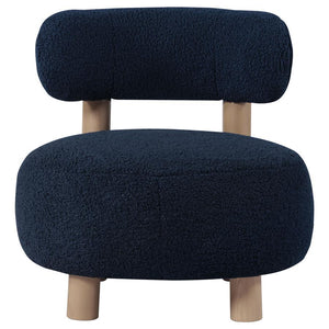  plush boucle upholster that sets a trendy ambiance. The chair shows off a low profile