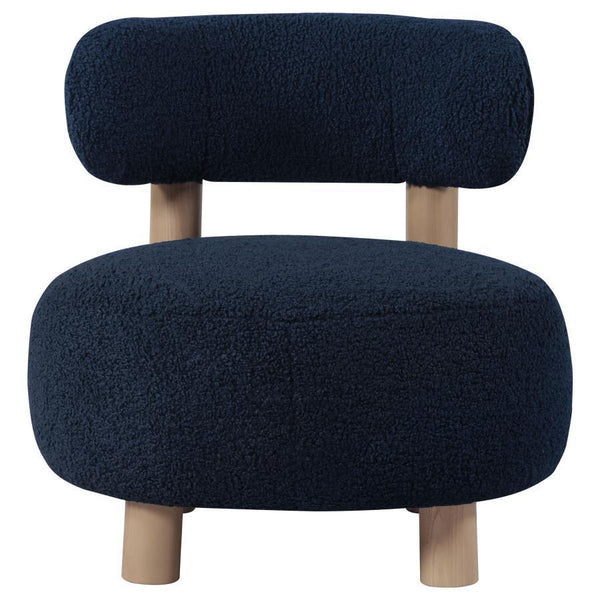  plush boucle upholster that sets a trendy ambiance. The chair shows off a low profile