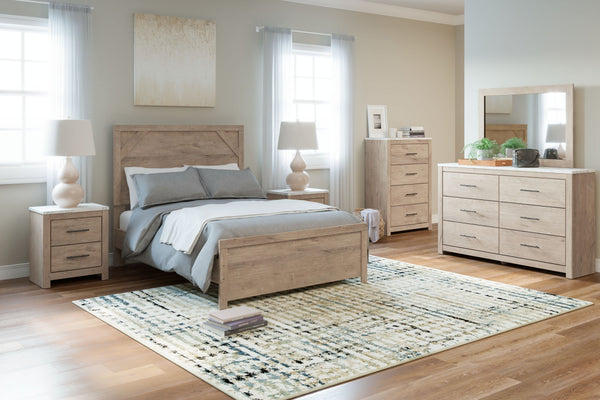 Cool, clean and casually modern. This panel bedroomâ€™s light natural finish sets the tone for your calming sanctuary. Framed elements and cross-brace accents add dimension and authenticity to the bedâ€™s simply stunning profile. <h4><b>Senniberg - Light 