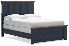 Add homespun charm to your restful retreat. A modern take on a timeless silhouette, this Landocken full panel bed pairs a dark slate blue finish with light brown accents. The slatted headboard in a classic Shaker style brings an air of beautiful simplicit