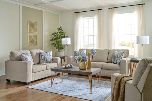 Youâ€™re in for a neat treat with this living room set. Its comfy seats are covered in soft, textural upholstery, and the wide track arms are eager to support your quest for total relaxation. Distressed abstract toss pillows bring a fresh breath of contem