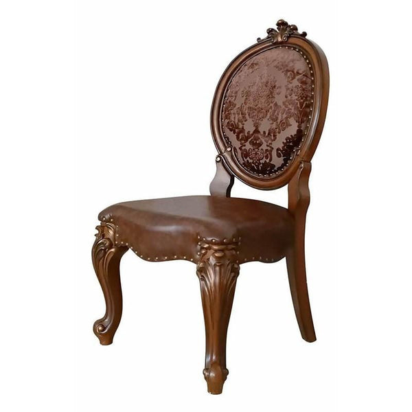 Irresistibly inviting, the Versailles collection displays the unrivaled beauty of the traditional dining. The dining table reflects highly decorative base with oversized scrolled feet, and the upholstered and tapestried chairs with deep button tufted and 