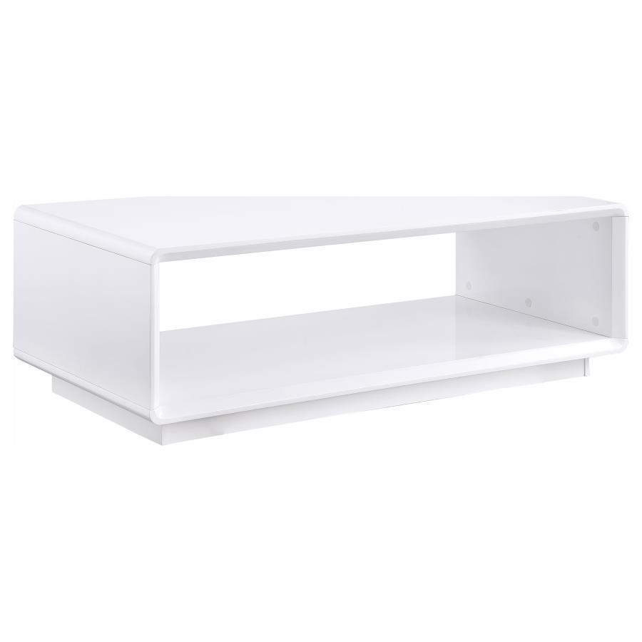 This rectangular coffee table exudes a sleek, modern aesthetic, thanks to a pristine white high gloss finish over engineered wood. Serving as a center table, cocktail table, or accent table, it introduces a clean, low table silhouette. The open shelf prov
