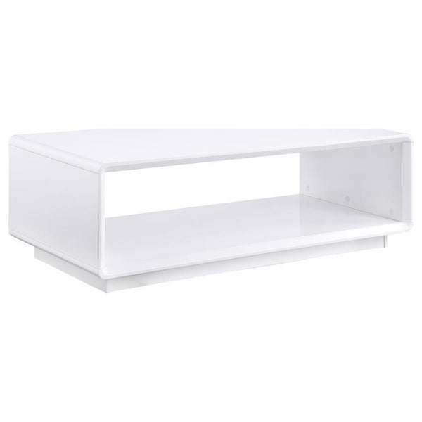 This rectangular coffee table exudes a sleek, modern aesthetic, thanks to a pristine white high gloss finish over engineered wood. Serving as a center table, cocktail table, or accent table, it introduces a clean, low table silhouette. The open shelf prov