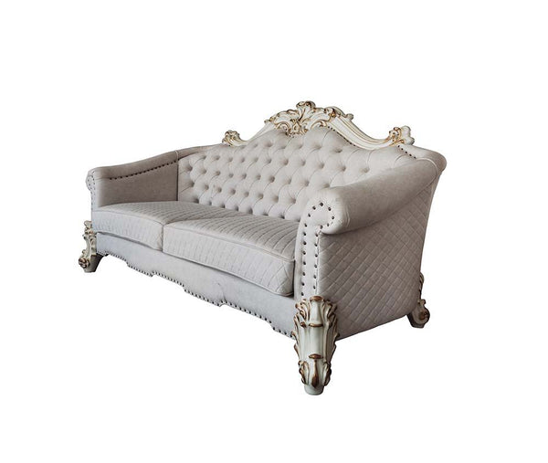 Tracing back to the classical Baroque era, expressed with intent and conviction, our new interpretation of Vendome II is donned. The Vendome II sofa-'s light gray fabric is grand and classy with crystal like button tufting on the back in a crackled gold p