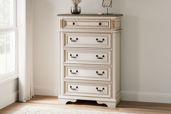  this chest of drawers is your dream bedroom retreat realized. Its antiqued two-tone aesthetic blends a chipped white with a distressed wood finished top for added charm. Framed drawer fronts and decorative