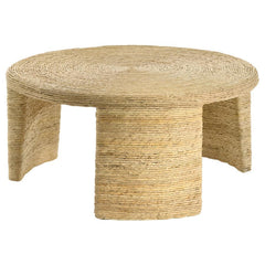 Elevate your living space with this coastal-inspired round coffee table, showcasing natural textures and timeless design. Crafted with woven rattan and banana leaf over a durable mahogany and plywood frame, it combines elegance and sturdiness. Its three b