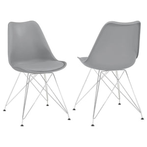 Designed with modern elegance in mind, this grey dining chair beautifully updates a contemporary home with its stylish silhouette and sleek materials. The seat and back are covered in smooth leatherette upholstery, adding a subtle textural appeal that pai