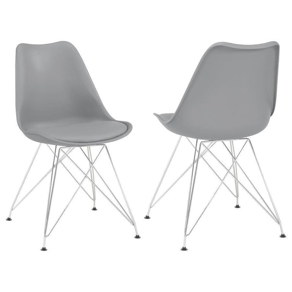 Designed with modern elegance in mind, this grey dining chair beautifully updates a contemporary home with its stylish silhouette and sleek materials. The seat and back are covered in smooth leatherette upholstery, adding a subtle textural appeal that pai