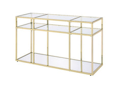 Modern simplicity makes your space feel uncluttered and stylish. The Uchenna Sofa Table has a brilliant color and lustrous finish to enhance it-'s sleek modern silhouette. Metal table frame in a gold finish exudes lustrous shine, topped with tempered glas