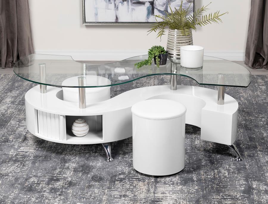 This coffee table features a serpentine shape with a clear tempered glass top and a durable engineered wood base. It includes two stools with padded seats, upholstered in faux leather for added comfort. A sliding door on both sides provides convenient sto