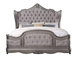  featuring intricate carvings that embody the period. The wingback headboard is a classic design is accented with crystal-l