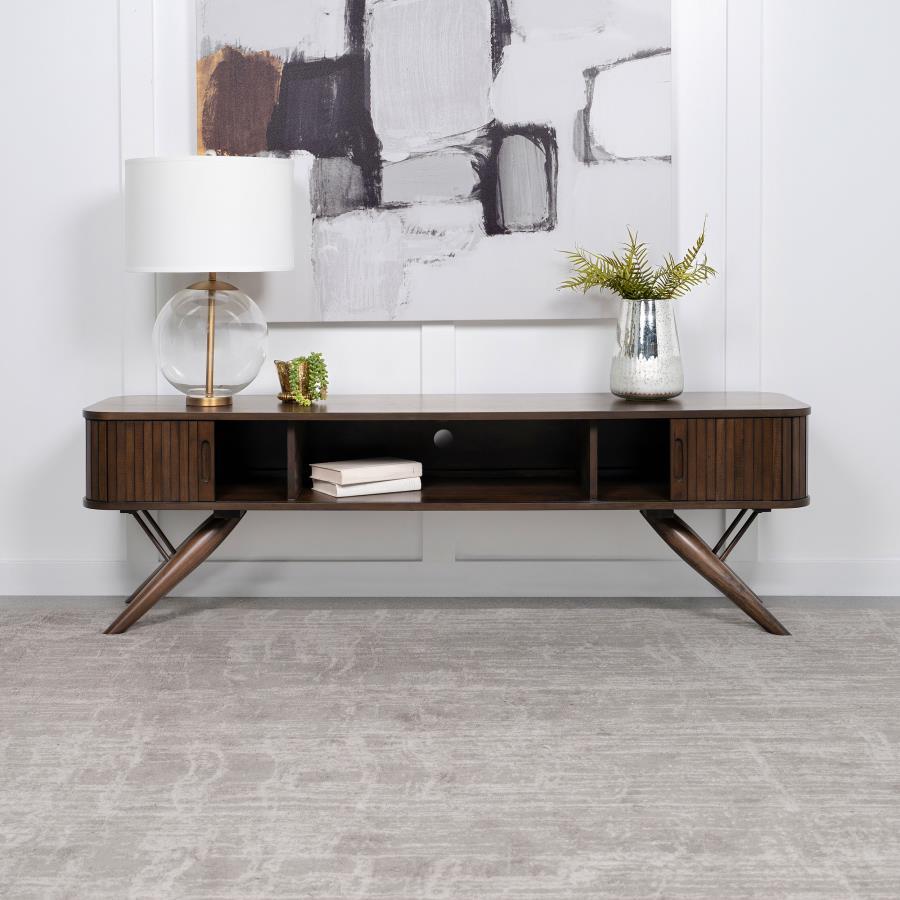 As the centerpiece of any sophisticated living room, this 71" TV stand, with its mid-century modern design, brings a touch of elegance and timeless charm. Its sleek silhouette is perfectly complemented by the rich walnut finish, offering a warm, inviting 
