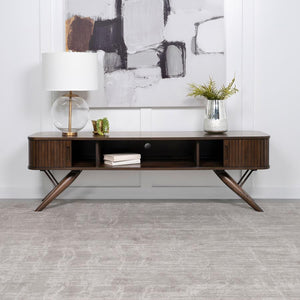 As the centerpiece of any sophisticated living room, this 71" TV stand, with its mid-century modern design, brings a touch of elegance and timeless charm. Its sleek silhouette is perfectly complemented by the rich walnut finish, offering a warm, inviting 