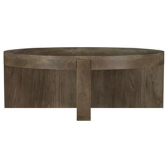 Center your living space around the striking, solid profile of a modern wooden coffee table. Crafted in exquisite mango wood, the table receives a dark brown finish to ensure standout style. The round cocktail table is a low, inviting centerpiece for your