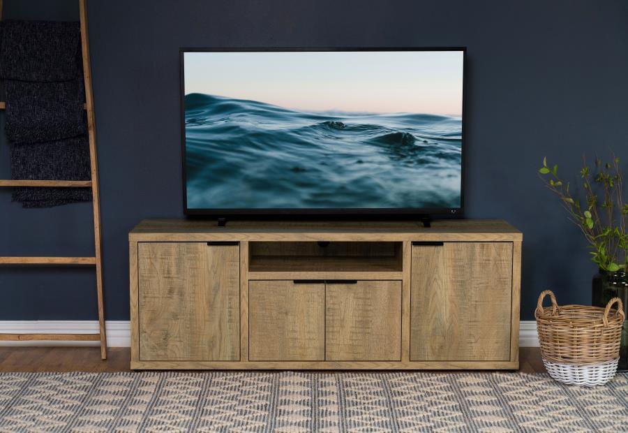 Center your entertainment set-up in this charming farmhouse TV stand. Featuring melamine paper in a mango finish, the console offers ample storage and plenty of charm. Layered coloring mimics the depth of true wood grain, while roughhewn saw marks add a s