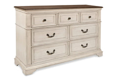 Complete your bedroom with the New Classic Furniture Anastasia 7 Drawer Dresser, a testament to real wood craftsmanship with solid poplar and oak veneer for enduring durability. The heirloom finish, achieved through a meticulous multi-step process involvi