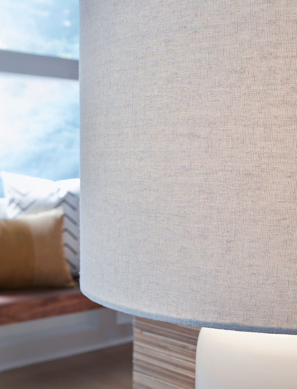  saturated bands of color that gradually fade to white toward the top. A natural fabric shade extends the tonal gradation and provides a tailored finishing touch.<br><