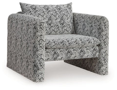 This fashion-forward accent chair keeps comfort and contemporary style at top of mind. Its eye-catching black and white geometric pattern makes a bold statement while remaining versatile enough to pair with other neutrals or pops of color. A low-profile b
