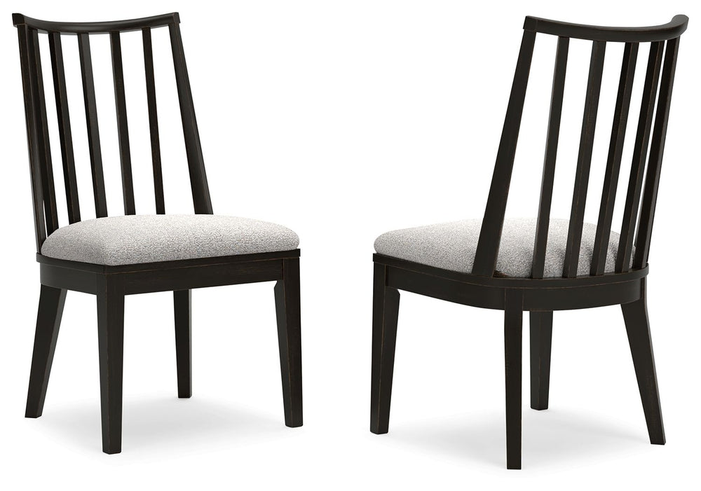 This dining chair brings a rustic vibe to urban contemporary design. Itâ€™s a modern approach to natural beauty, with an aged black finish defining the chic curved backrest. And the chairâ€™s color palette is stunningly simple, allowing it to coordinate s