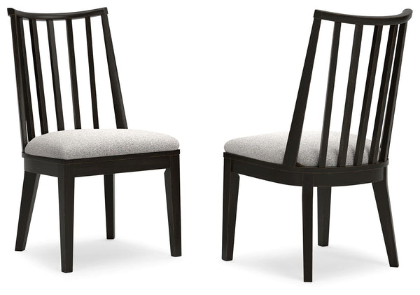 This dining chair brings a rustic vibe to urban contemporary design. Itâ€™s a modern approach to natural beauty, with an aged black finish defining the chic curved backrest. And the chairâ€™s color palette is stunningly simple, allowing it to coordinate s