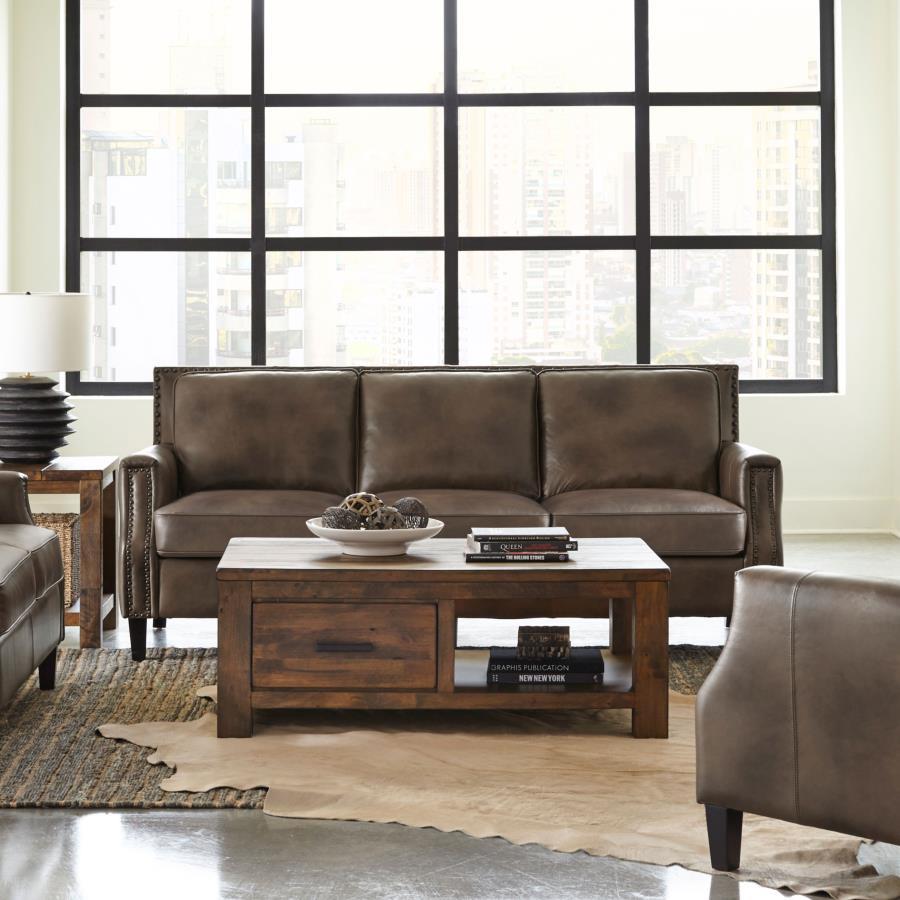 Set your sights on a sofa that brings comfort and style to your living space. Upholstered in an attractive brown sugar fabric, this piece consists of luxurious leather grain fabric. Recessed arms add a modern element to this piece that-'s ideal for loungi