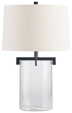 Inspired by master glass artisans, this unique table lamp is designed to highlight its quality materials. Crafted with clear, artistically textured glass with classic antiqued black metal detailing, this stunning lamp adds an elegant touch to any room.<br