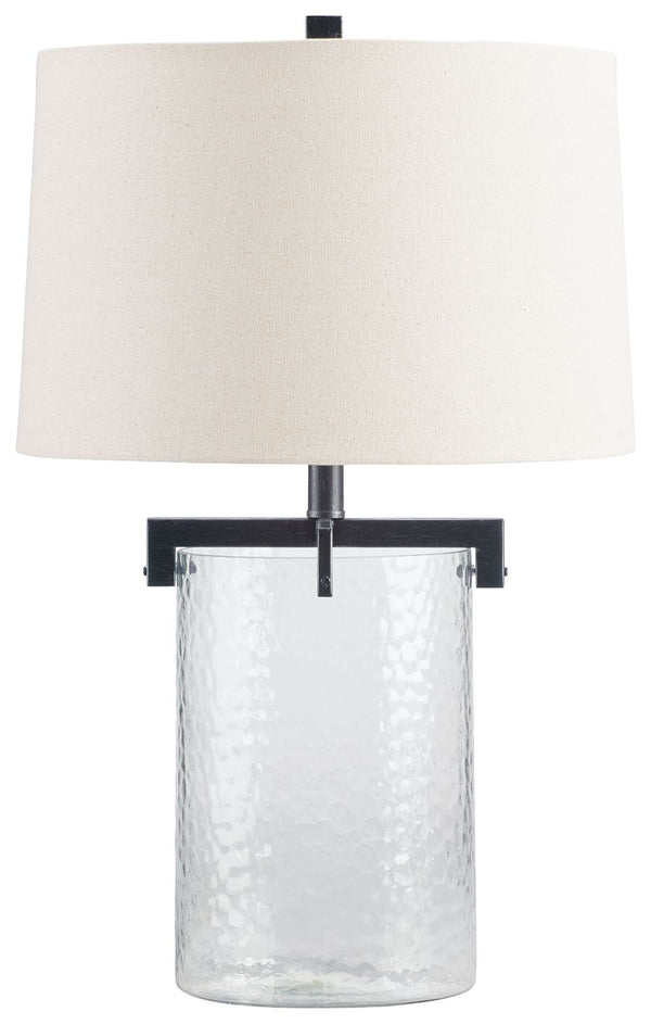 Inspired by master glass artisans, this unique table lamp is designed to highlight its quality materials. Crafted with clear, artistically textured glass with classic antiqued black metal detailing, this stunning lamp adds an elegant touch to any room.<br