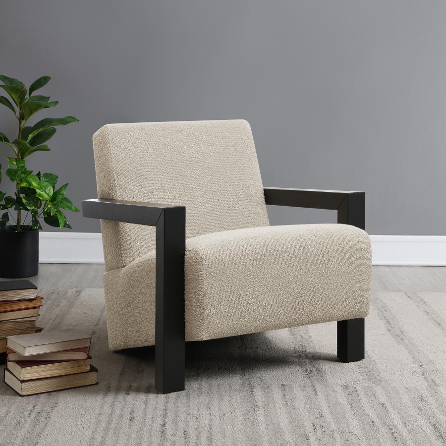 Exposed wood armrests add a sense of precision and structure to a modern accent armchair. It-'s a fresh, refined look with a neutral palette and minimalist allure. A slightly reclined seat and back create an inviting silhouette for the chair, which blends