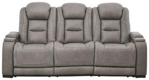 Reserved for him and made for her, this power reclining sofa in gray delivers all the comfort and style you could ask for. Inspired by sports car interiors, the expertly matched leather and faux leather upholstery has a â€œperforated automotiveâ€ treatme
