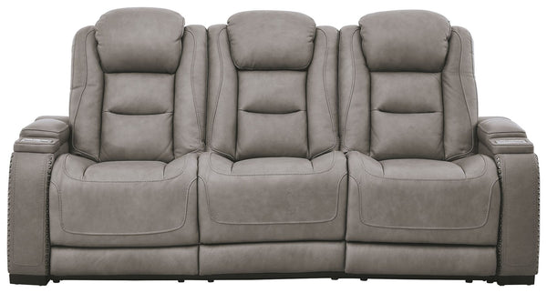 Reserved for him and made for her, this power reclining sofa in gray delivers all the comfort and style you could ask for. Inspired by sports car interiors, the expertly matched leather and faux leather upholstery has a â€œperforated automotiveâ€ treatme