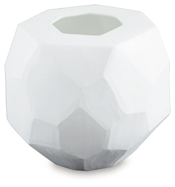 Equal parts elegant and organic, this vase brings ethereal beauty to your tabletop. Its white finish seamlessly harmonizes with existing accents. Meticulous craftsmanship creates the unique, faceted look of the hand-carved surface and makes each piece one