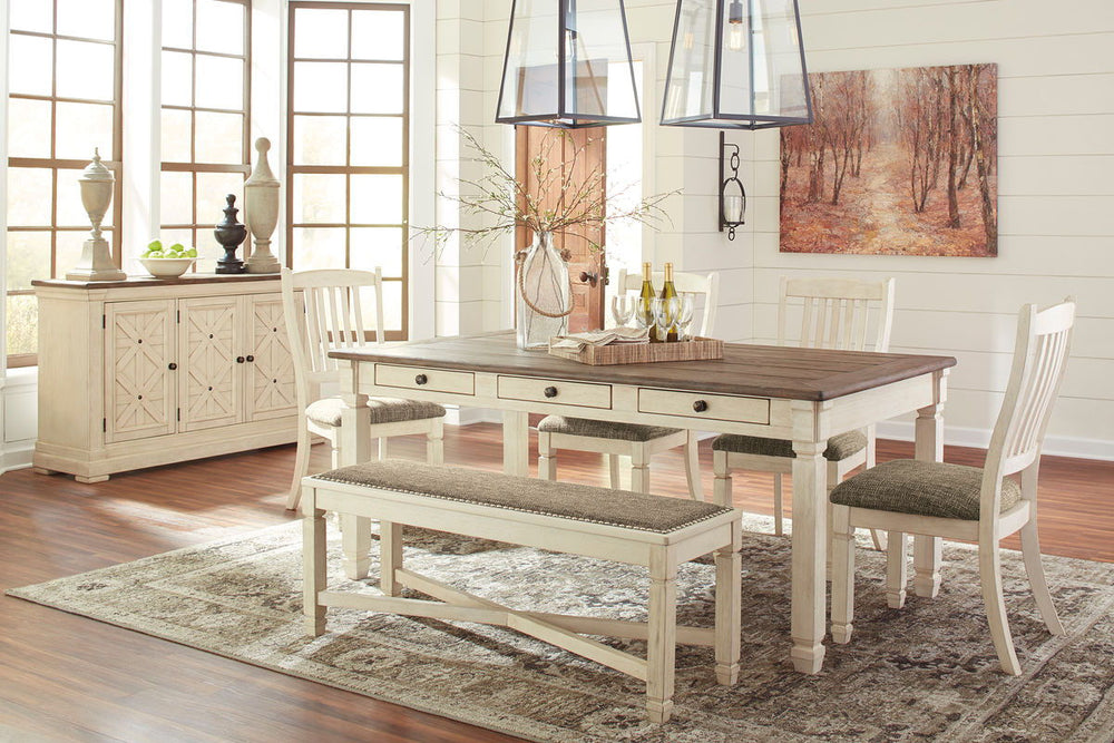 Unique two-tone finish with a combination of Oak and Acacia substrates combining a trendy textured antique white color with table and server tops finished in a textural weathered oak finish. Rectangular dining table features six convenient drawers for sto