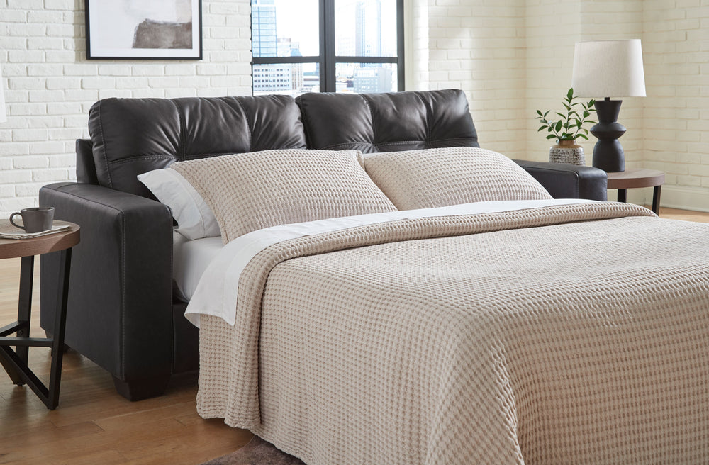 Everyday comfort meets versatile style in this sofa sleeper. The handsome hue of the goes-with-anything faux leather takes away the stress of styling, expertly pairing with your existing aesthetic. And a handy built-in sleeper effortlessly transforms this
