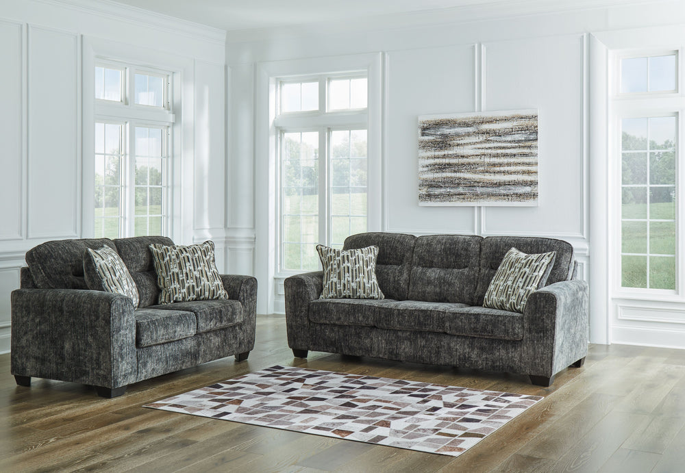 This sofa and loveseat set speaks to those drawn to fresh, contemporary style with richly neutral appeal. Subtle and sophisticated, the plush upholstery and dark tri-block legs are a natural complement for so many color schemes. Two accent pillows make th