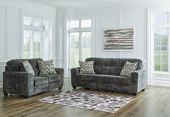 This sofa and loveseat set speaks to those drawn to fresh, contemporary style with richly neutral appeal. Subtle and sophisticated, the plush upholstery and dark tri-block legs are a natural complement for so many color schemes. Two accent pillows make th