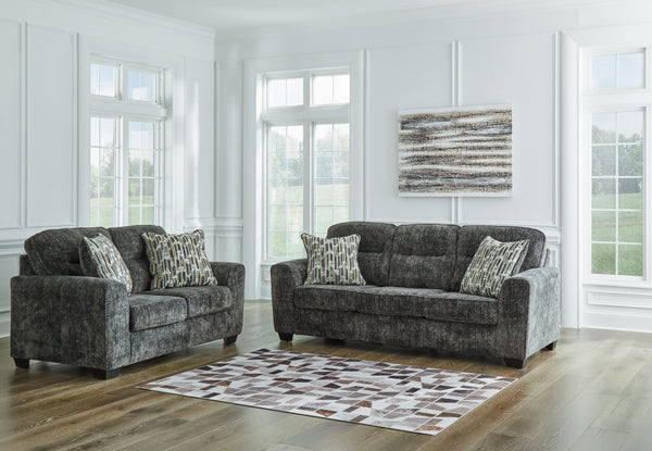 This sofa and loveseat set speaks to those drawn to fresh, contemporary style with richly neutral appeal. Subtle and sophisticated, the plush upholstery and dark tri-block legs are a natural complement for so many color schemes. Two accent pillows make th