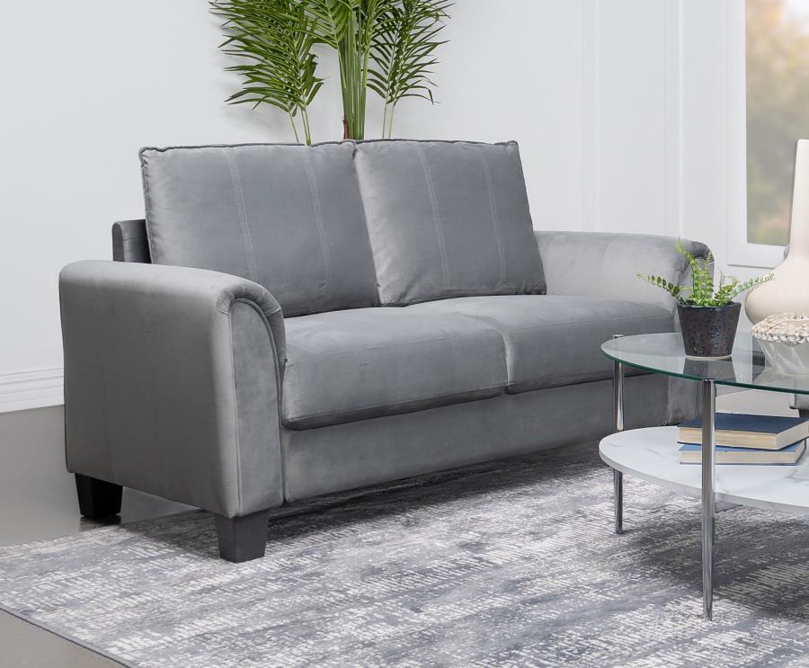 Embrace modern elegance with the refined look of a contemporary upholstered loveseat. Designed for understated character and timeless elegance, it boasts soft gray fabric with a velvety texture that encourages a cozy but sophisticated presence in your liv