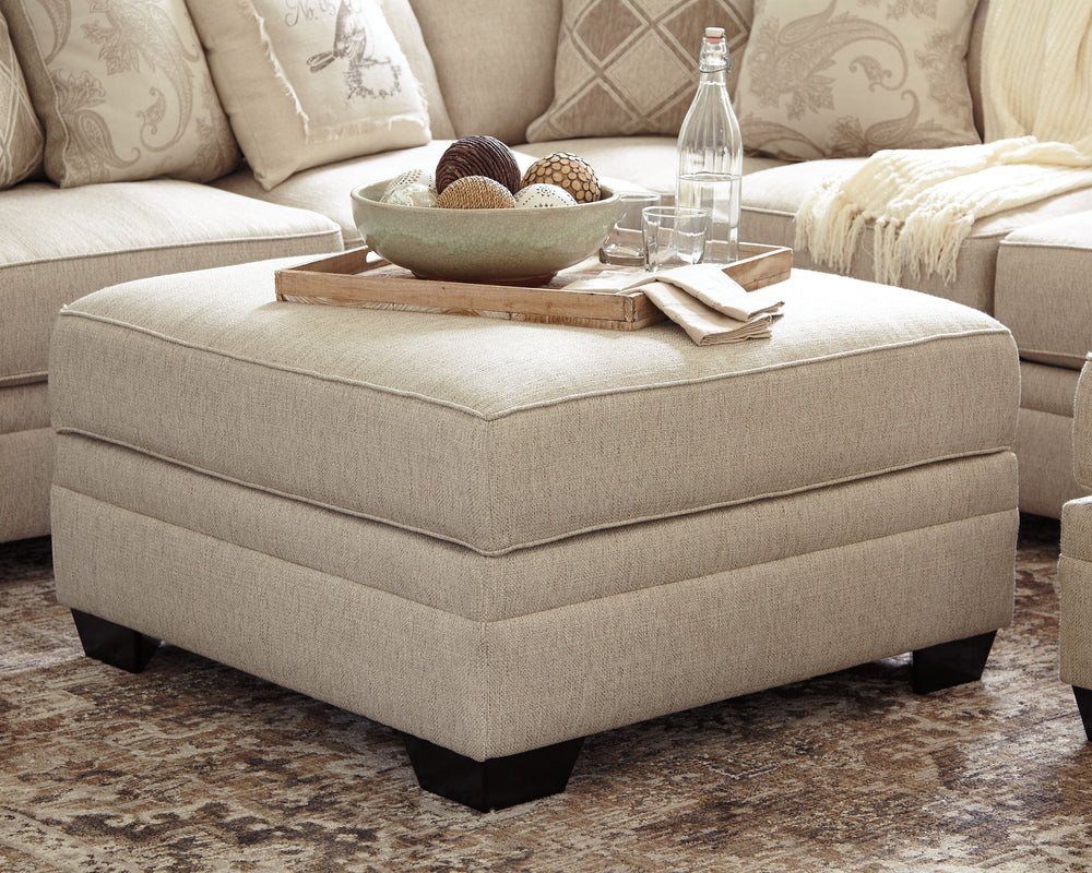 Stow in love. This ottoman with storage has you covered in more ways than one. Its ample scale makes it abundantly luxuriousâ€”leaving plenty of room for everyone to kick up their heels in style. For last-minute cleanups, what a lifesaver. Removable top u
