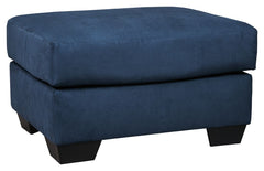 Talk about fine lines and great curves. Thatâ€™s the beauty of this standout ottomanâ€”made to suit your appreciation for simplicity and love of contemporary style. Tapered feet and an ultra-soft upholstery that holds up to everyday living complete this f