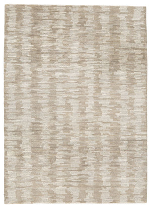 The hand-tufted modern design of this area rug will make a bold statement in any room. By alternating the pattern flow, the weavers have created a work of art alive with texture. Shades of cream and brown are blended to produce an abstract-yet-tranquil fe