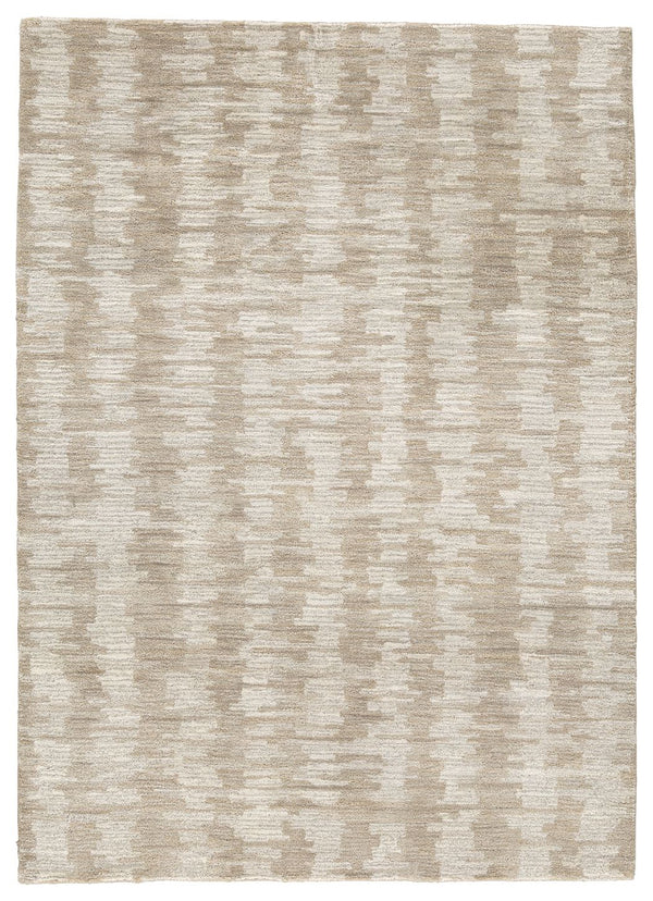 The hand-tufted modern design of this area rug will make a bold statement in any room. By alternating the pattern flow, the weavers have created a work of art alive with texture. Shades of cream and brown are blended to produce an abstract-yet-tranquil fe