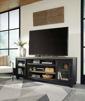  casual contemporary style simply done right. Its two-tone color scheme features a rich brushed black finish accented with a dusty grayish brown wood tone. With two glass-front cabinets (each with an adjustabl