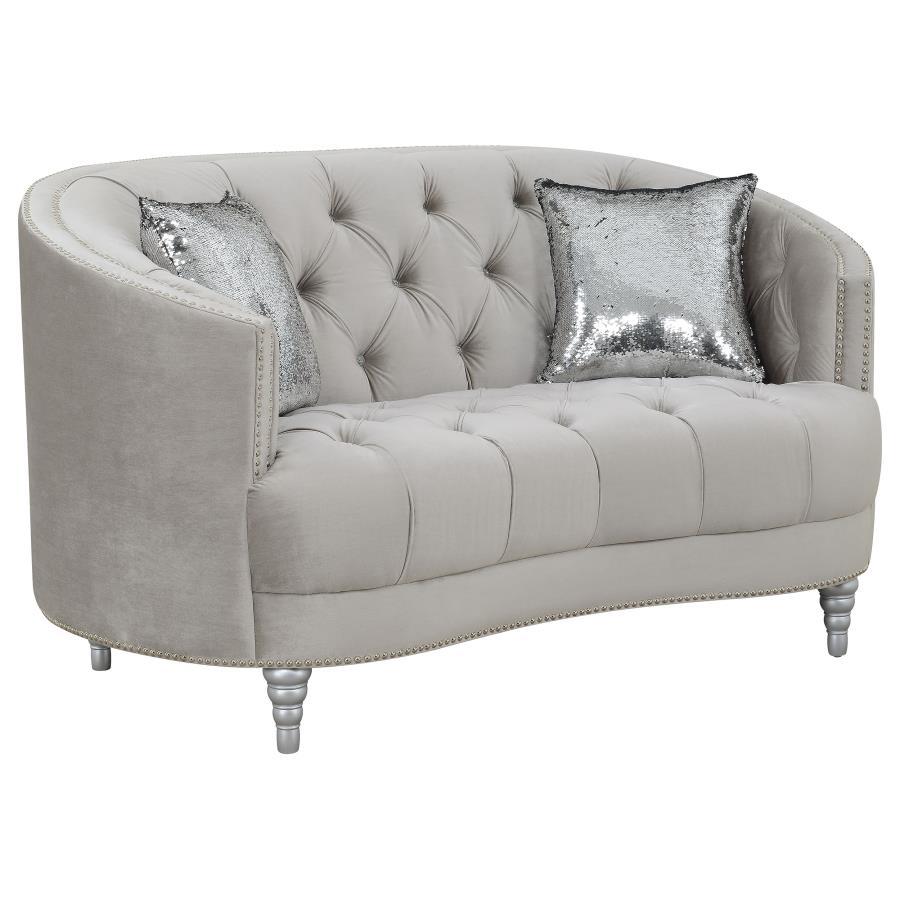 This loveseat envelops you in romantic style and luxury. The button-tufted design is timeless and classic. The wraparound seat back curves down to convenient armrest. Sink into thick cushions for hours peace and quiet while huddled with a book or a partne