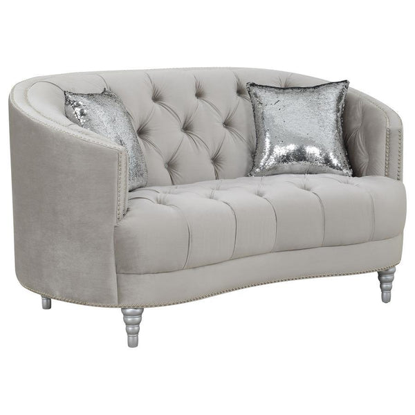 This loveseat envelops you in romantic style and luxury. The button-tufted design is timeless and classic. The wraparound seat back curves down to convenient armrest. Sink into thick cushions for hours peace and quiet while huddled with a book or a partne